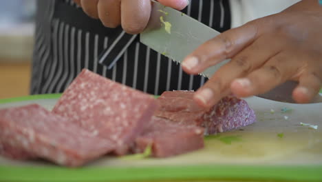 Cutting-and-slicing-salami-to-serve-over-antipasto-chopped-salad---ANTIPASTO-SALAD-SERIES