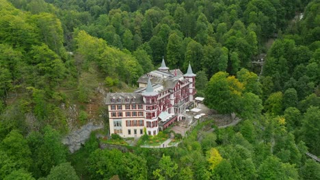 Aerial-view-of-the-Giessbach-hotel-and-waterfall