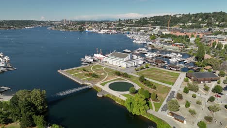 Aerial-shot-of-The-Center-for-Wooden-Boats-in-Seattle-on-a-bright-sunny-day