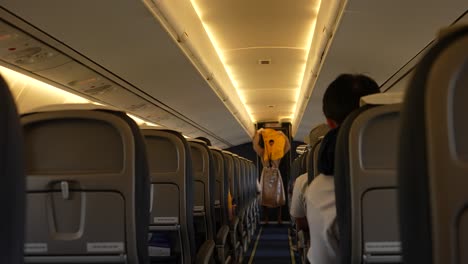 Flight-Attendant-Giving-Safety-Instructions-to-Plane-Passenger-Slow-Mo-4k