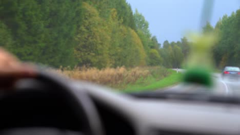 Shaky-blurry-view-through-car's-windshield,-abstract-travel-concept