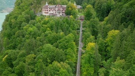 Aerial-reveal-of-the-Giessbach-hotel-and-funicular-tracks
