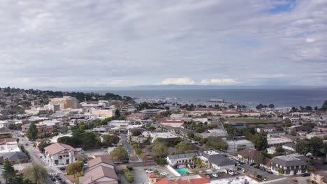 Low-wide-aerial-shot-of-the-Old-Fisherman's-Wharf-in-Monterey-Bay-from-downtown-Monterey,-California