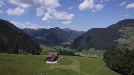Green-meadow-in-Switzerland-during-summertime,-between-the-mountain