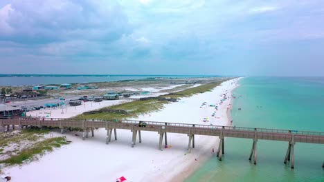 Drone-aerial-view-flying-down-the-side-of-the-Pier-in-Navarre-Beach-Florida
