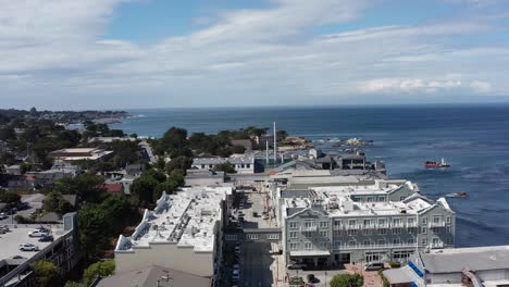 Wide-rising-aerial-shot-of-the-world-famous-Monterey-Bay-Aquarium-in-the-Cannery-Row-neighborhood-of-Monterey,-California