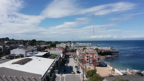Wide-aerial-shot-flying-over-historic-Cannery-Row-in-Monterey,-California