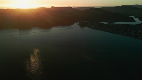 Cinematic-sunrise-reveal-in-Cooks-Beach,-New-Zealand