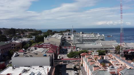 Close-up-aerial-shot-flying-over-historic-Cannery-row-in-Monterey,-California