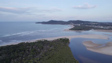 Aerial-Of-Sandy-Beach-And-Ocean-Coast-Of-Noosa-Heads-On-Sunshine-Coast,-Australia---drone-shot