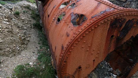 Exploring-large-industrial-rusty-tank-container-on-abandoned-Welsh-Traeth-Porth-Wen-brickwork-factory