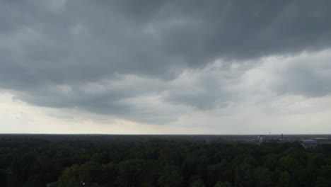 A-drone-shot-of-stormy-sky-with-dramatic-clouds-from-an-approaching-thunderstorm-at-sunset