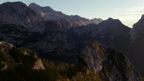 Forward-movement-with-a-drone-filmed-beautiful-mountains-in-the-alps-at-sunrise-with-a-clear-sky-in-4k-2