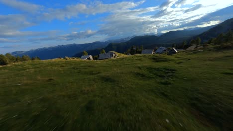 Fpv-footage-was-filmed-in-the-Slovenian-mountain-village-in-the-alps-with-a-drone-flying-fast-over-mountains-filmed-with-a-GoPro-with-surrounding-landscapes-flying-between-and-over-small-wooden-cabins-6