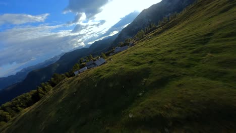 Fpv-footage-was-filmed-in-the-Slovenian-mountain-village-in-the-alps-with-a-drone-flying-fast-over-mountains-filmed-with-a-GoPro-with-surrounding-landscapes-flying-between-and-over-small-wooden-cabins-5