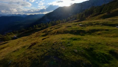 Fpv-footage-was-filmed-in-the-Slovenian-mountain-village-in-the-alps-with-a-drone-flying-fast-over-mountains-filmed-with-a-GoPro-with-incredible-surrounding-landscapes-with-a-hiker-holding-a-flag-1