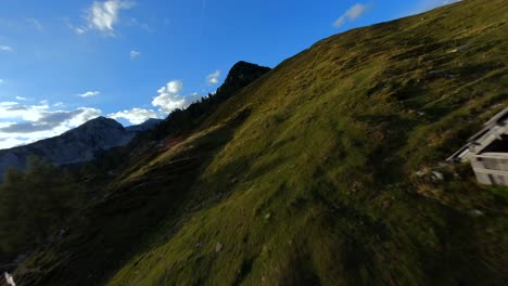 Fpv-footage-was-filmed-in-the-Slovenian-mountain-village-in-the-alps-with-a-drone-flying-fast-over-mountains-filmed-with-a-GoPro-with-surrounding-landscapes-flying-between-and-over-small-wooden-cabins-4