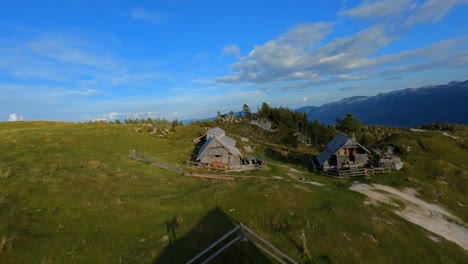 Fpv-footage-was-filmed-in-the-Slovenian-mountain-village-in-the-alps-with-a-drone-flying-fast-over-mountains-filmed-with-a-GoPro-with-surrounding-landscapes-flying-between-and-over-small-wooden-cabins-2