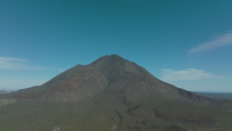 Aerial-Approach-to-Mexico's-Tres-Virgenes-Volcano,-Copy-Space-in-Sky