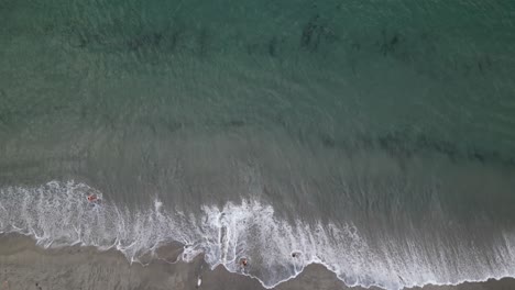 Birds-Eye-Aerial-View-of-Ocean-Waves-Breaking-on-Sandy-Beach-in-Twilight,-Boca-Raton,-Florida-USA,-Top-Down-Drone-Shot