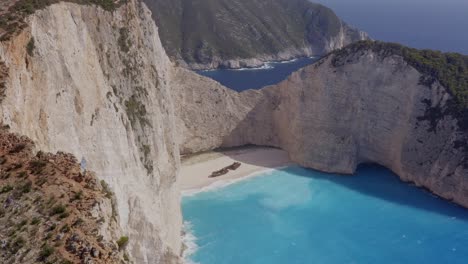 Aerial---Shipwreck-slow-reveal-from-the-side-in-Zakynthos,-Greece