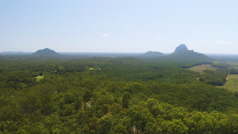 Aerial-Drone-Flyover-Australian-Countryside,-Glasshouse-Mountains-Green-Forest,-4K