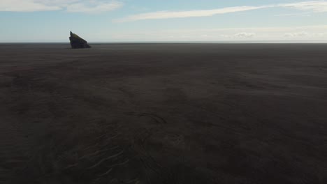 Black-Sand-Desert-with-Rocky-outcrop