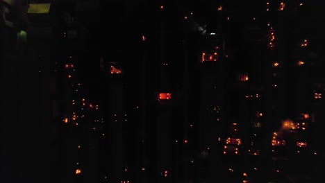 Aerial-view-above-a-graveyard-illuminated-with-moody-lights,-during-Dia-de-Muertos,-in-Mexico-city---top-down,-drone-shot