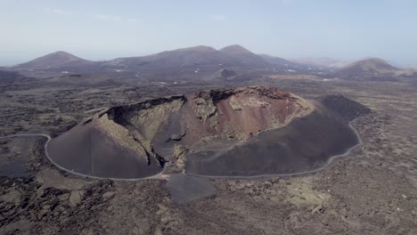 Huge-volcanic-crater,-dormant-volcano,-Lanzarote-aerial-4k
