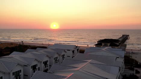 Sunrise-aerial-over-homes-at-wrightsville-beach-nc,-north-carolina