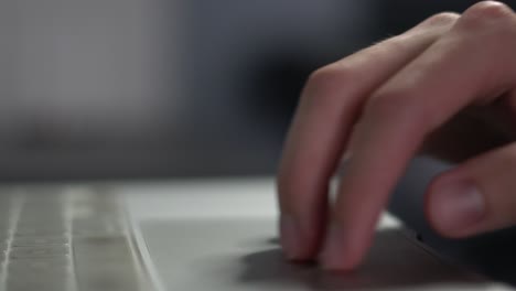 Male-hand-and-fingers-gesture,-scroll-and-pinch-on-computer-trackpad-close-up