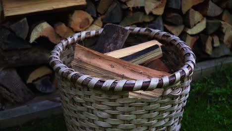 Fresh-cut-wood-in-a-basket-to-bring-back-in-to-the-house-in-winter