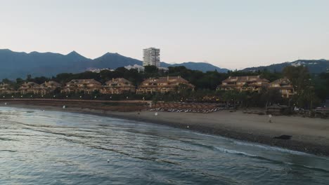 Coastline-of-one-of-the-beaches-in-Marbella-after-sundown,-Spain