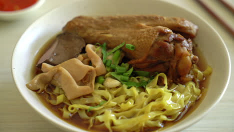 Egg-noodles-with-stewed-and-braised-duck-in-brown-soup---Asian-food-style-1