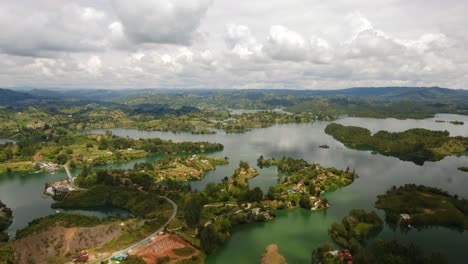 Guatape,-Medellin,-Colombia-Time-Hyper-Lapse-Aerial-Above-El-Peñol-Scenic-Water-and-Famous-Stone-Hills