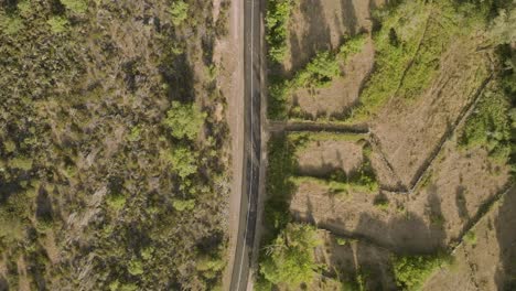 Aerial-top-down-view-of-rural-road-in-Spanish-countryside