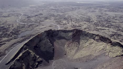 Aerial-shot-of-volcanic-landscape,-craters-and-frozen-lava