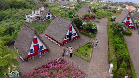 Flying-over-the-bungalow-houses-and-huts-in-Santana-Madeira-Portugal