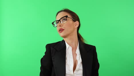 Bored-businesswoman-wearing-black-formal-office-suit-and-white-shirt-shows-boxing-gloves-and-start-punching-looking-at-camera