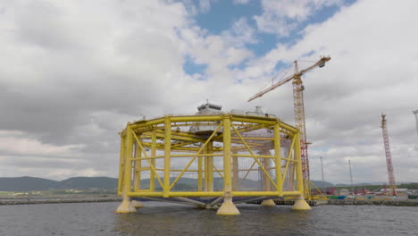 Massive-yellow-Ocean-Farm-1-offshore-fish-farm-structure-under-construction-in-Norway