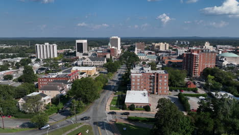 Aerial-flight-above-Coleman-Hill-Park-towards-tree-lined-Mulberry-Street-in-downtown-Macon,-Georgia