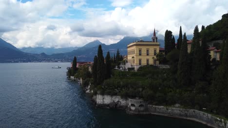 Drone-shot-rising-over-the-historic-town-Varenna-on-Lake-Como-in-Italy