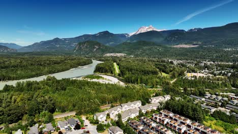 Aerial-View-Of-Squamish-Town-Residential-Houses,-River,-And-Mountains-In-British-Columbia,-Canada
