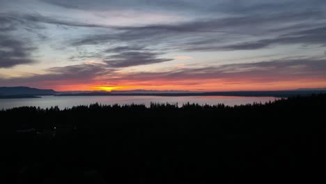 Aerial-shot-tilting-up-from-the-Western-Washington-University-campus-to-reveal-the-sunset-over-Bellingham-Bay