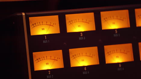 VU-meters-at-a-recording-studio-with-the-needles-indicating-the-sound-intensity---isolated-close-up