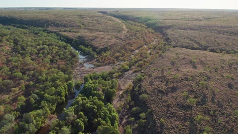 Aerial-footage-of-where-the-Wattie-Creek-and-Stevens-Creek-meet-before-the-community-of-Daguragu,-Northern-Territory,-Australia