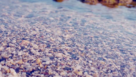 Close-up-of-pebbles-under-the-water-surface