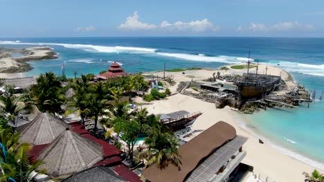 Exotic-coastline-resorts-near-sandy-beach-and-coastline-of-Bali-island,-aerial-view