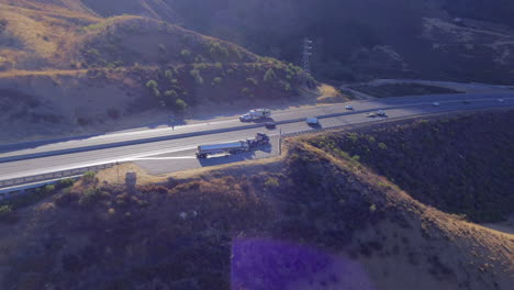 Aerial-orbit-view-of-truck-roadside-assistance-next-to-busy-highway