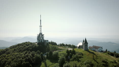 Aerial-panoramic-shot-of-dron-around-the-hill-Kum-with-church-and-tower-on-him-in-Slovenia